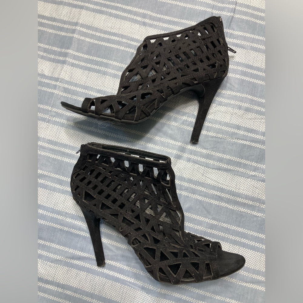 Zigisoho black caged, open-toed booties.